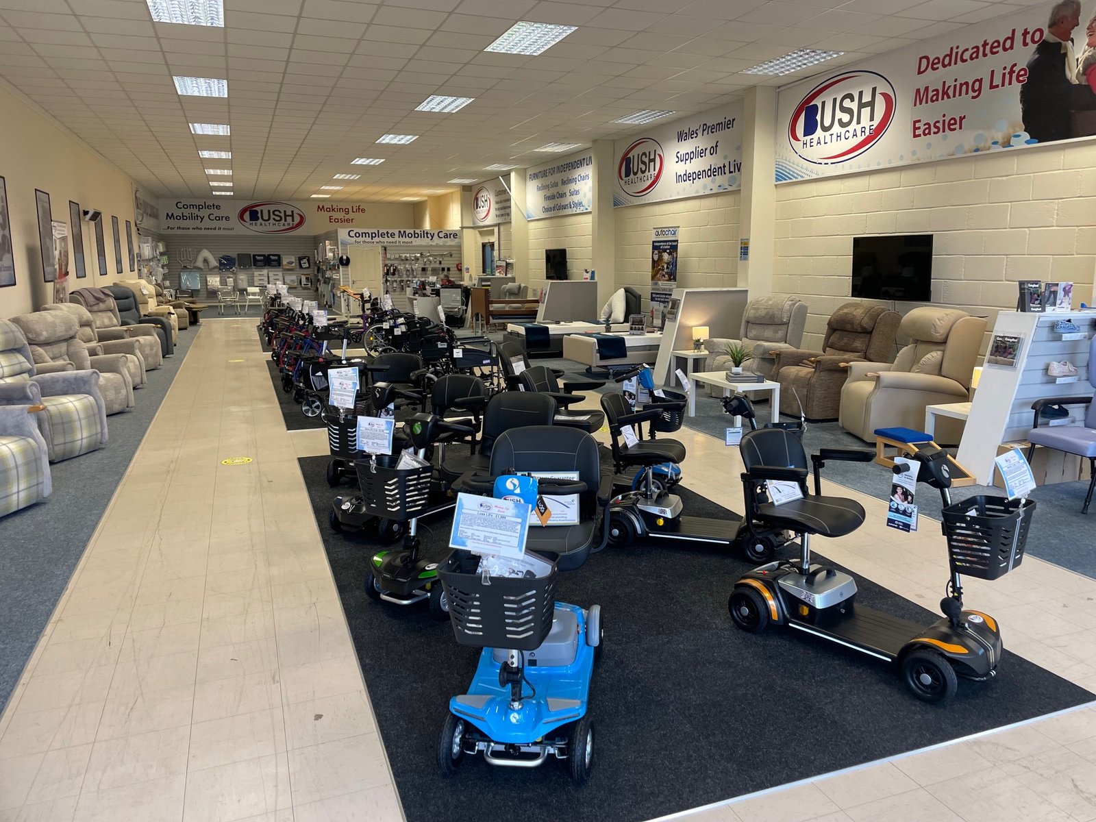 Large Bush Healthcare showroom with mobility scooters on display
