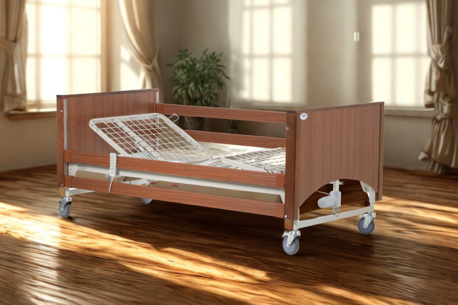 Alerta Lomond Standard Profiling Bed with wooden frame and adjustable mattress platform in a bedroom.