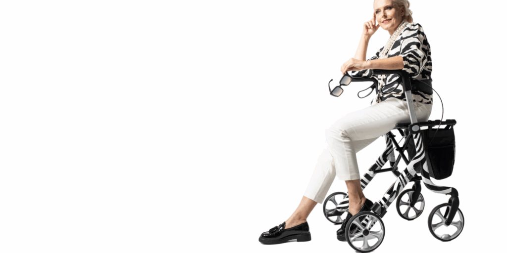 Space LX Art Line Rollator Lifestyle Picture in Zebra Print, demonstrating a lady sat in the rollator.
