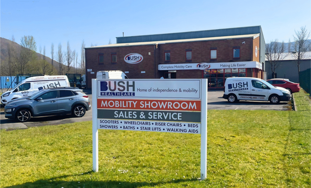 Store front of Bush HealthCare Aberdare on a summers day.