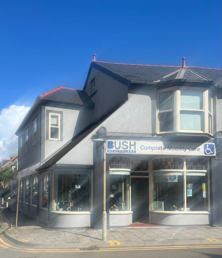 Storefront of Bush HealthCare Porthcawl store on a bright sunny day.
