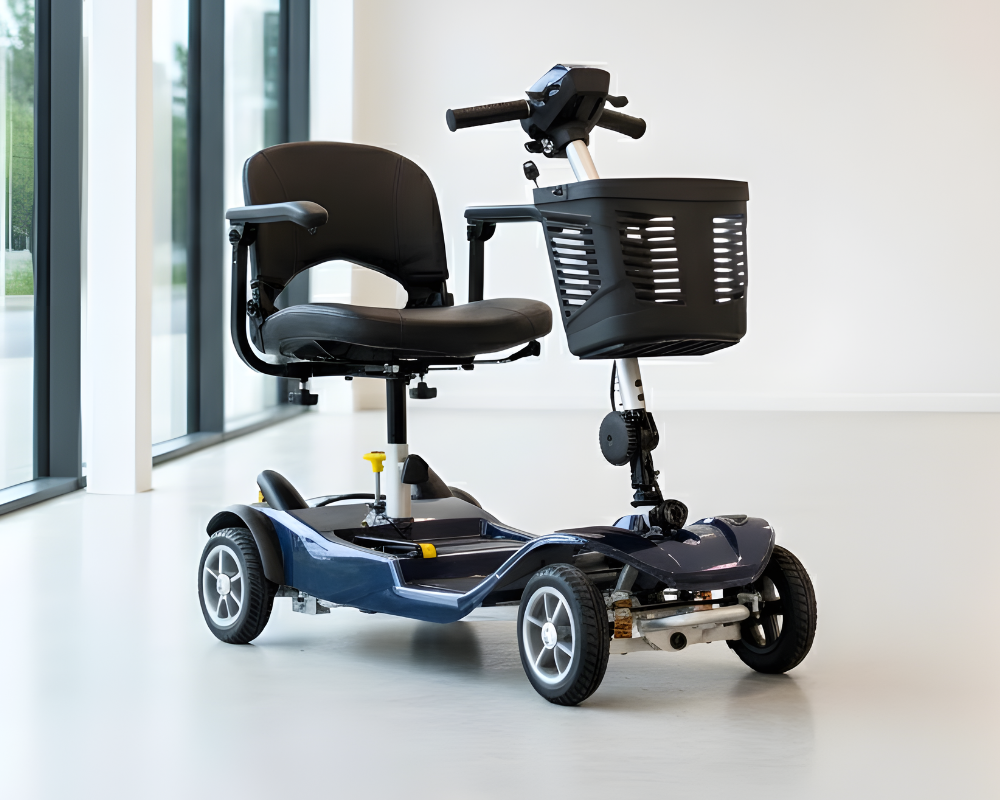 The compact, dark blue Drive Astrolite mobility scooter with a black seat and front basket, pictured in a bright, modern indoor setting