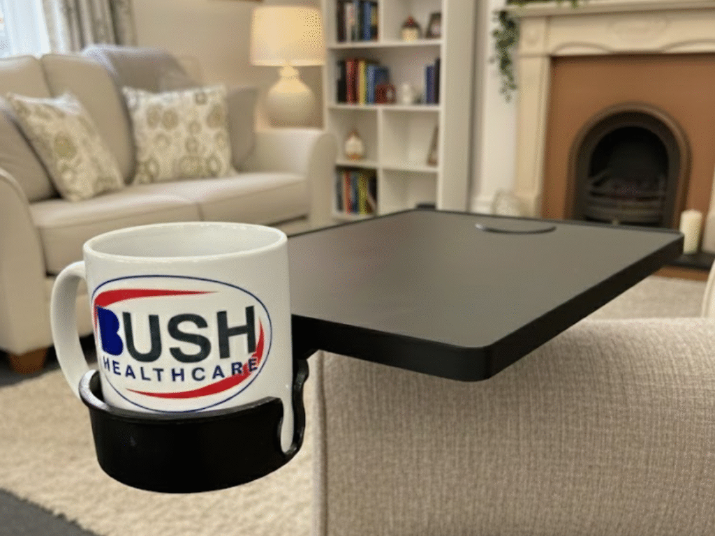 lack tray table accessory with cup holder attached to a chair armrest, ideal for use with a riser recliner chair.