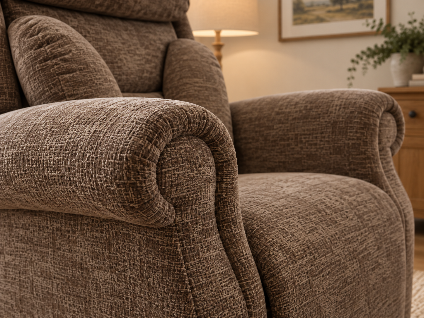 Broad cushioned scroll arms on the Skenfrith riser recliner
